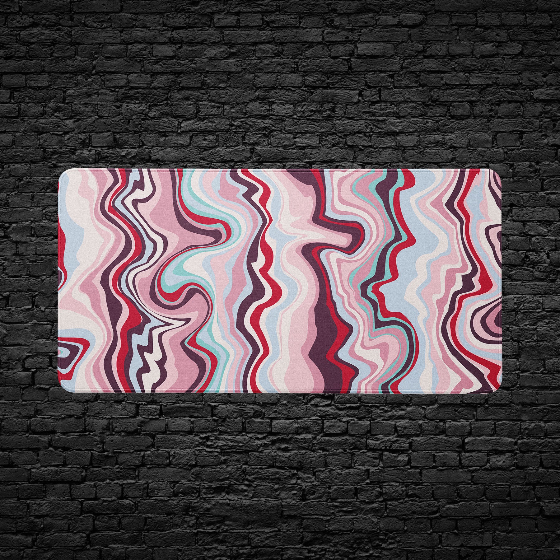 Colorful wavy patterned rug on a black brick wall