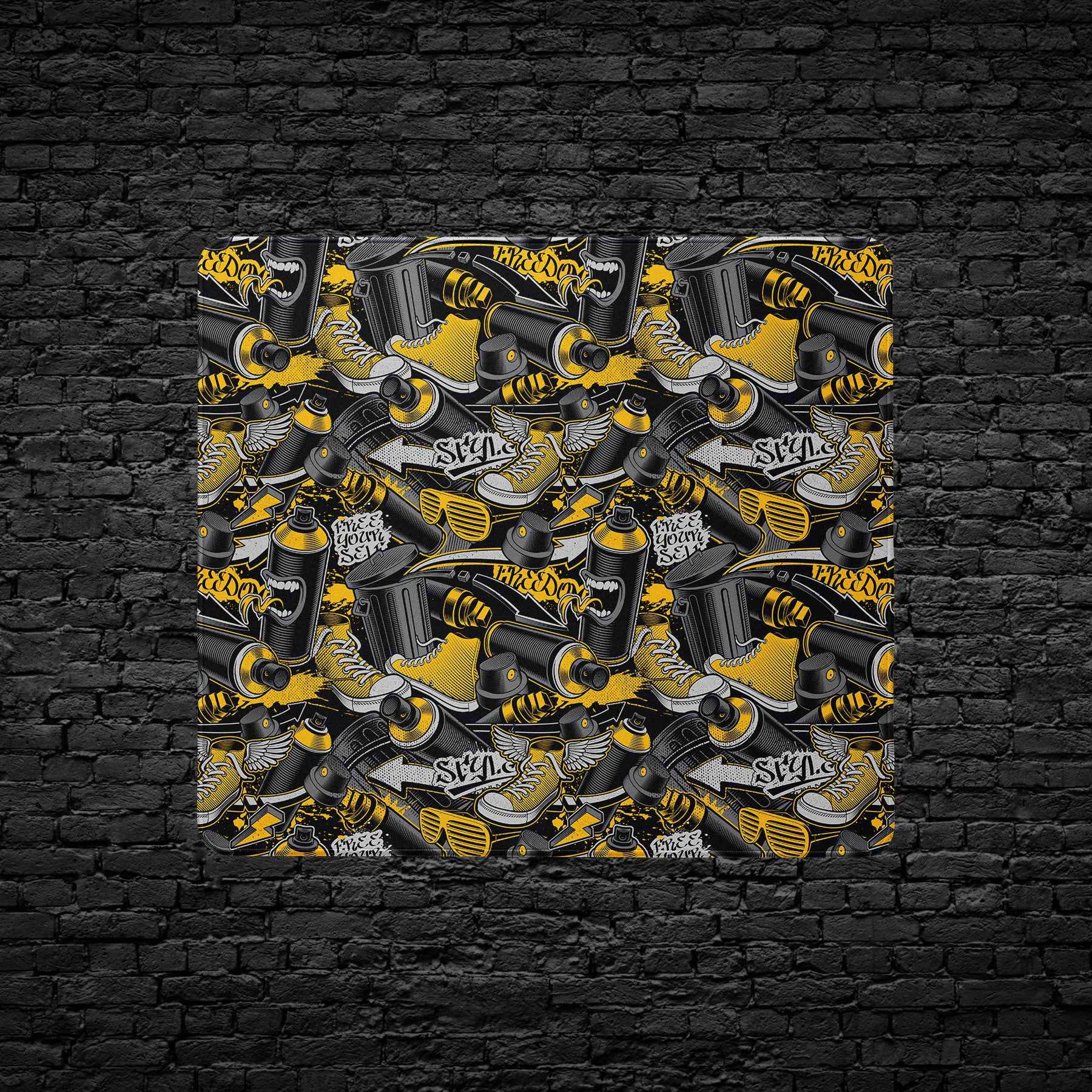 Black and yellow graffiti desk mat featuring street culture design
