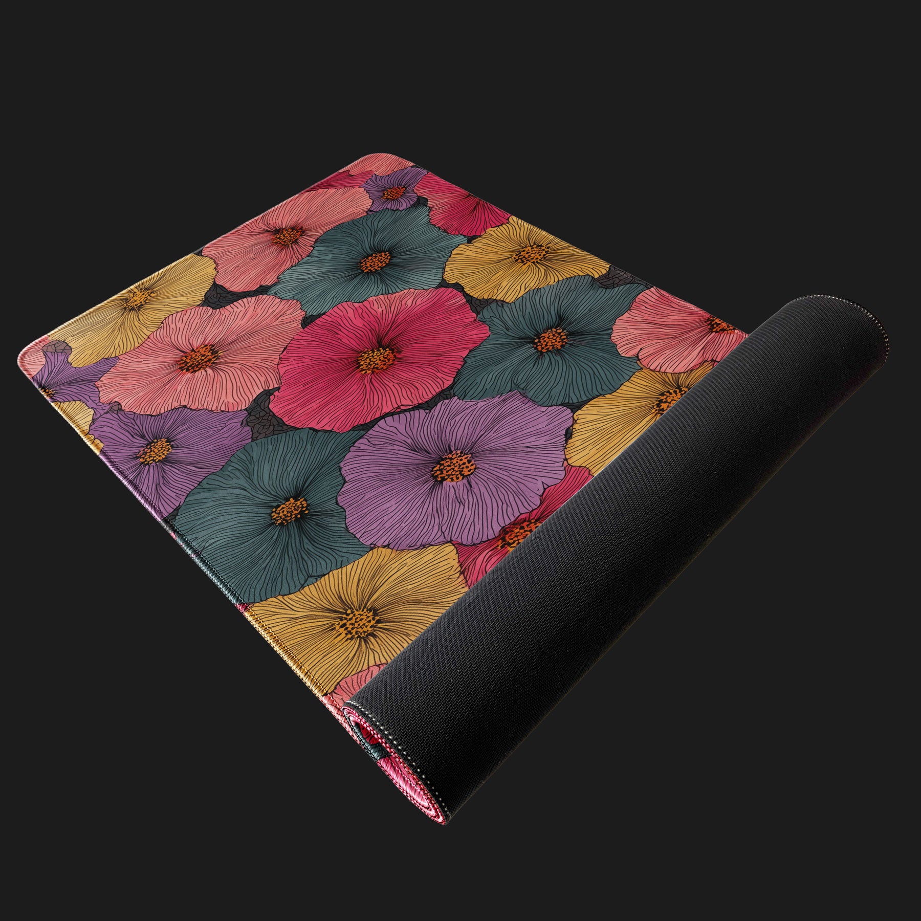 Custom desk mat featuring colorful flower artwork and stitched edges.