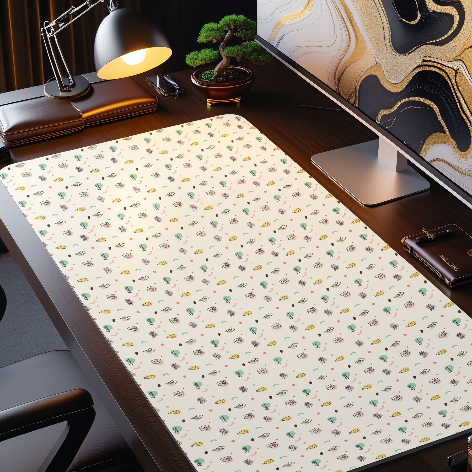 Desk setup with a decorative mouse pad featuring a pattern of small illustrations.