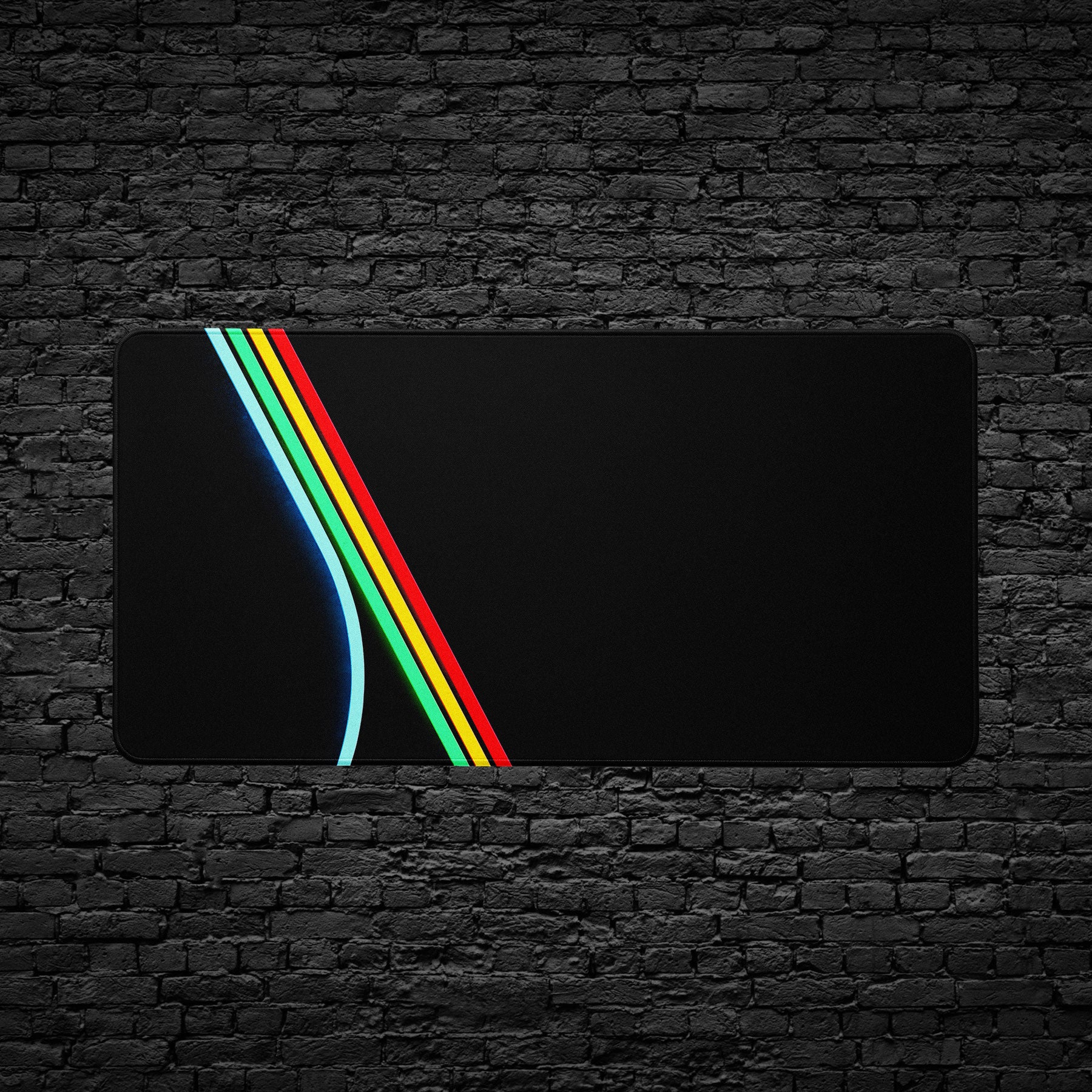 ARC Raiders Large - Black mouse pad with colorful stripe design on a black brick wall background