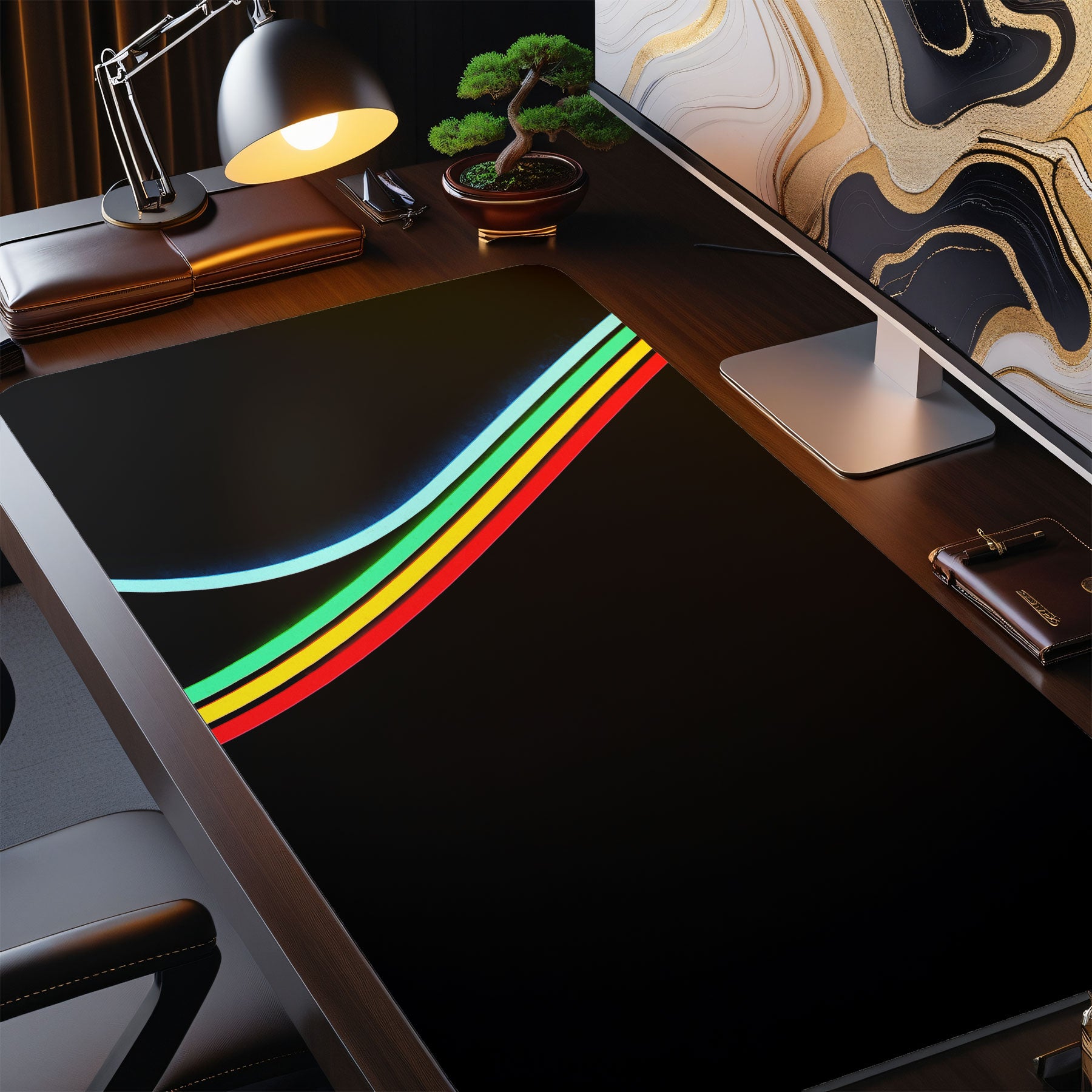 Desk setup with an ARC Raiders colorful desk mat featuring rainbow stripes, office chair, and computer monitor.
