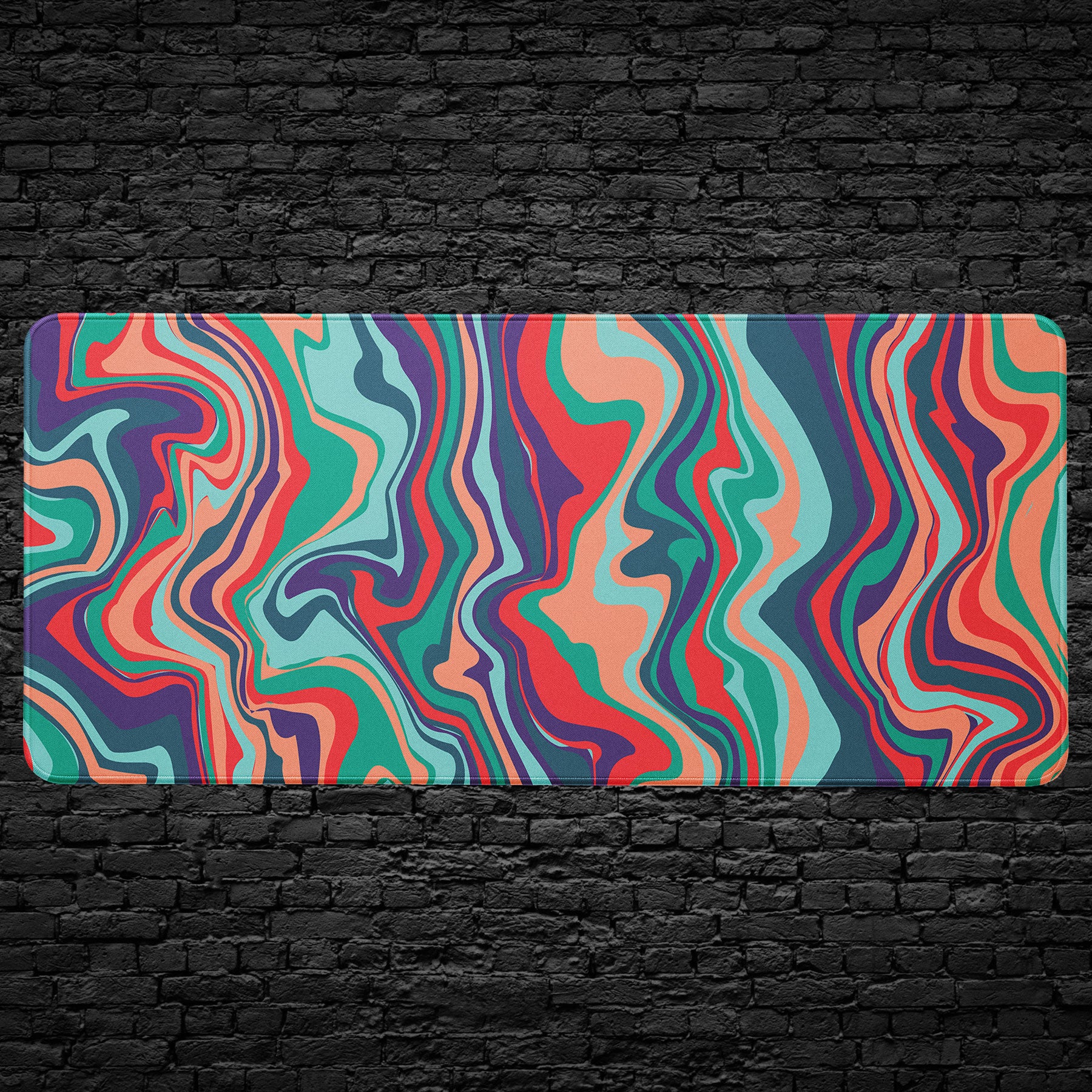 Colorful abstract desk mat with wavy red, teal, purple, and coral lines