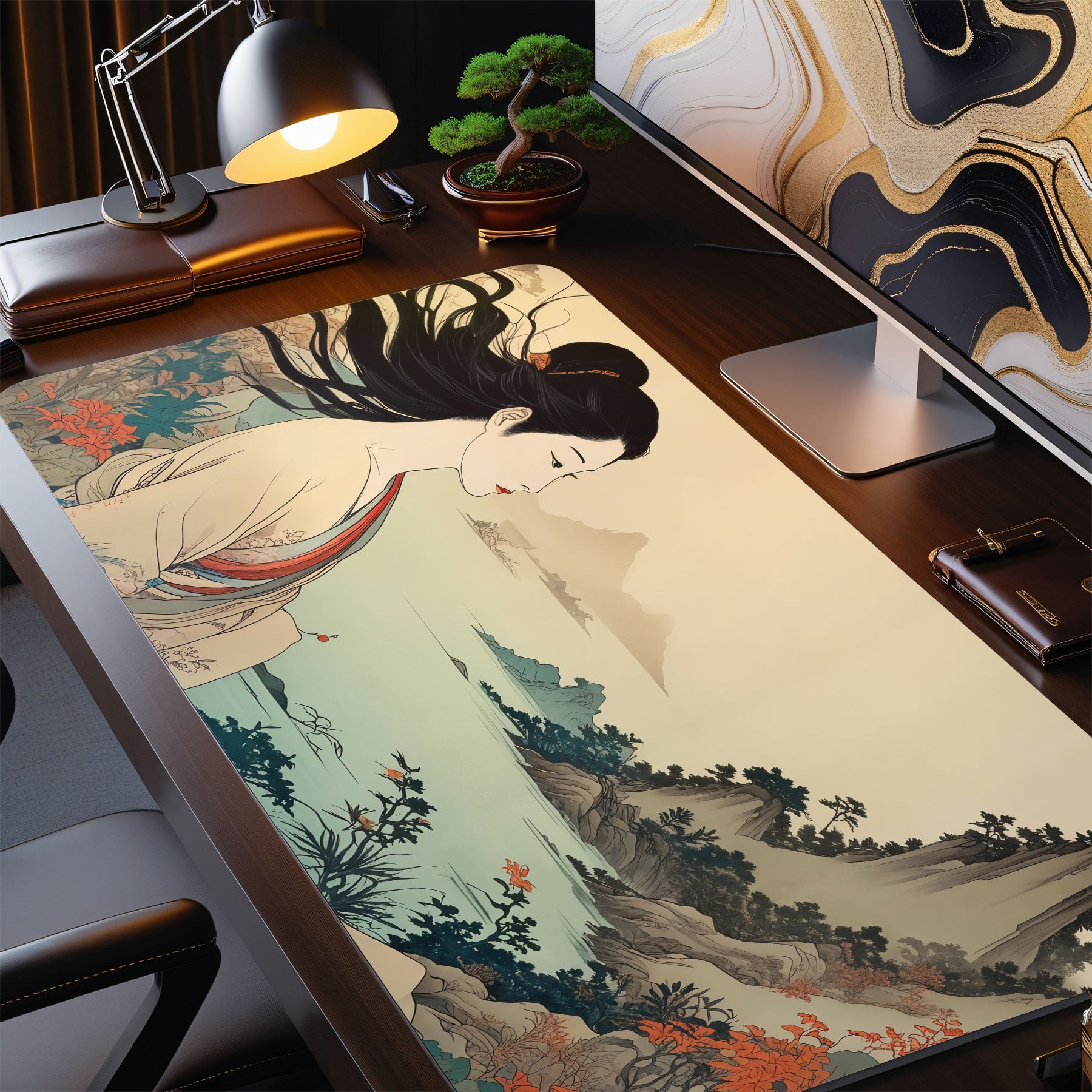 Desk setup with a large desk mat featuring an artistic design of a woman and mountain landscape.