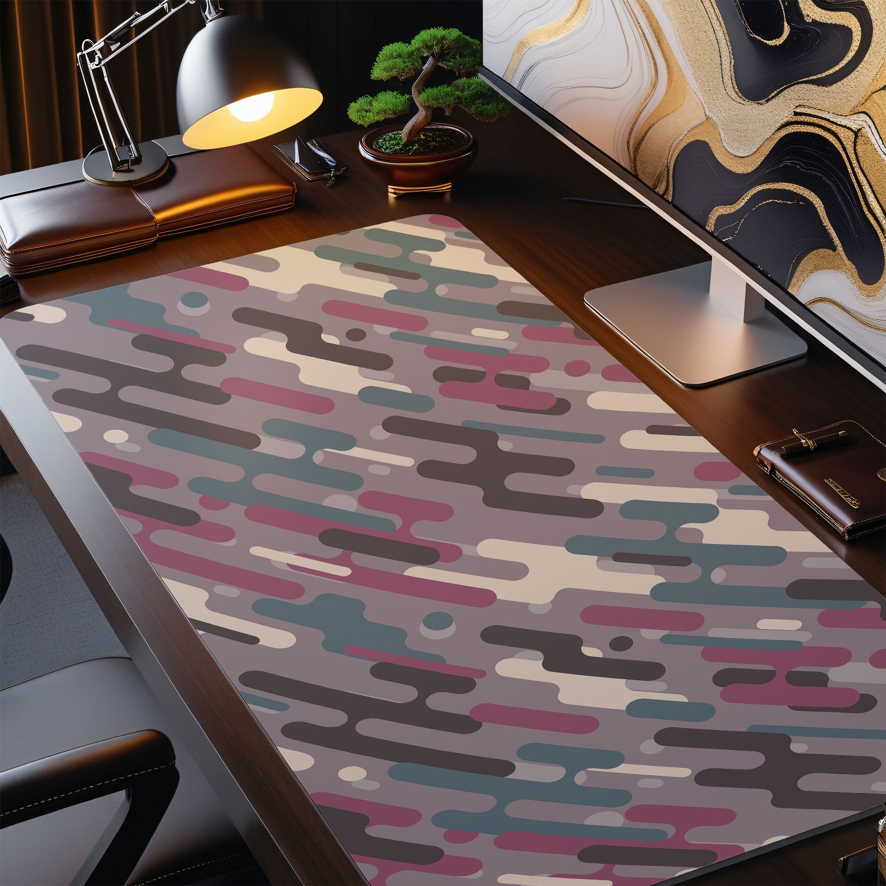 Colorful abstract patterned rug on a desk with office items.