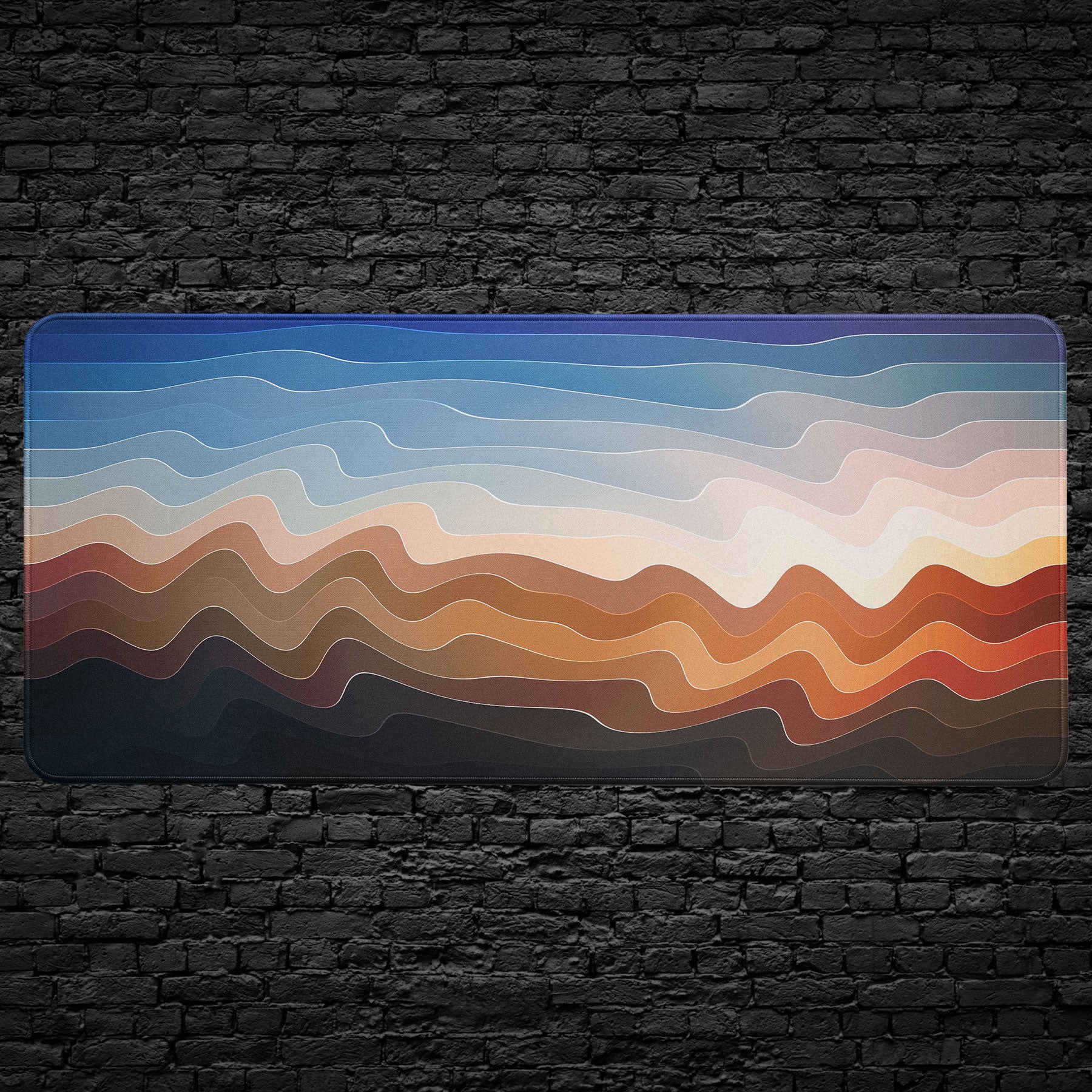 Abstract wave pattern desk pad in gradient blue and terracotta tones