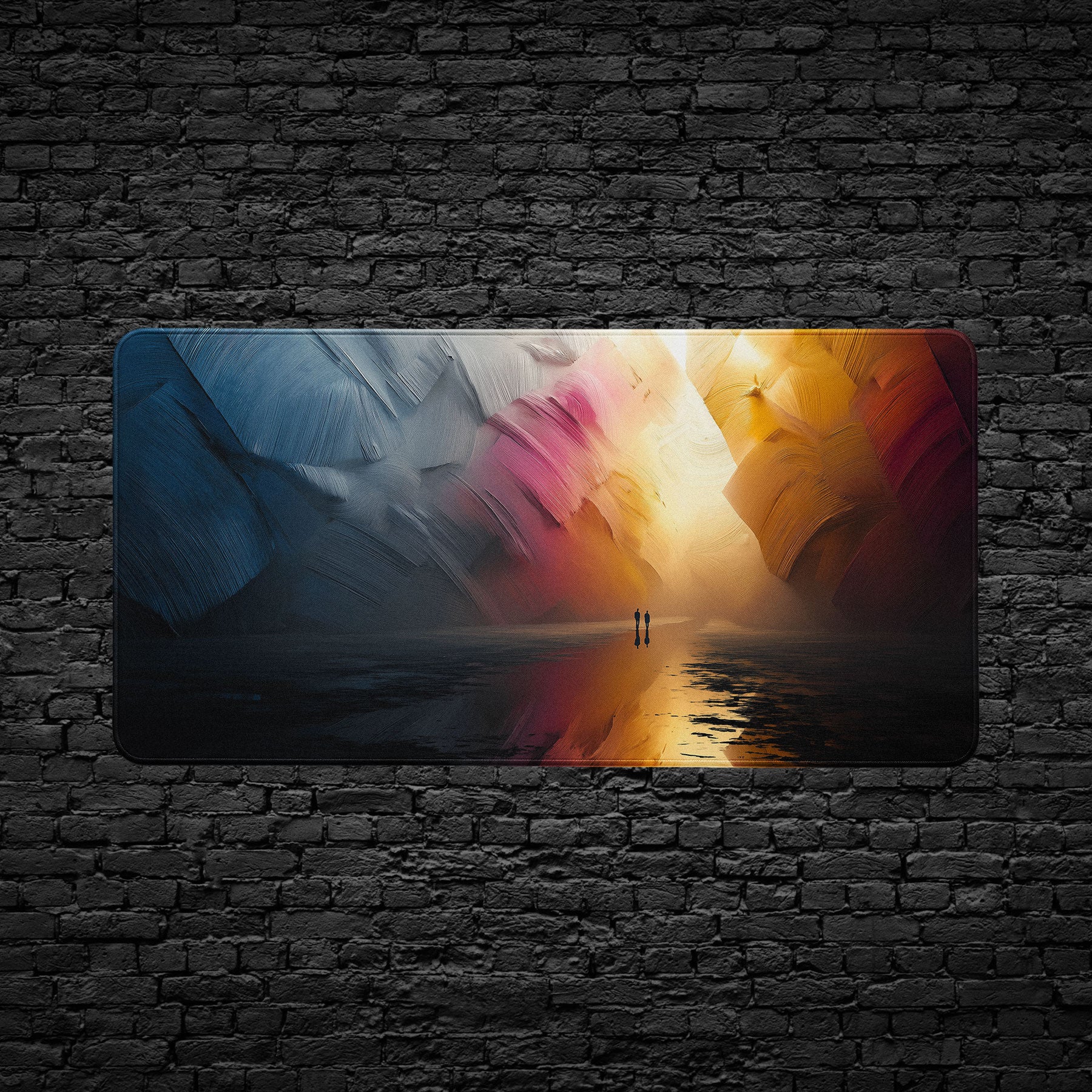 Extended desk mat featuring colorful canyon-inspired artwork in blue, gold, and red abstract tones