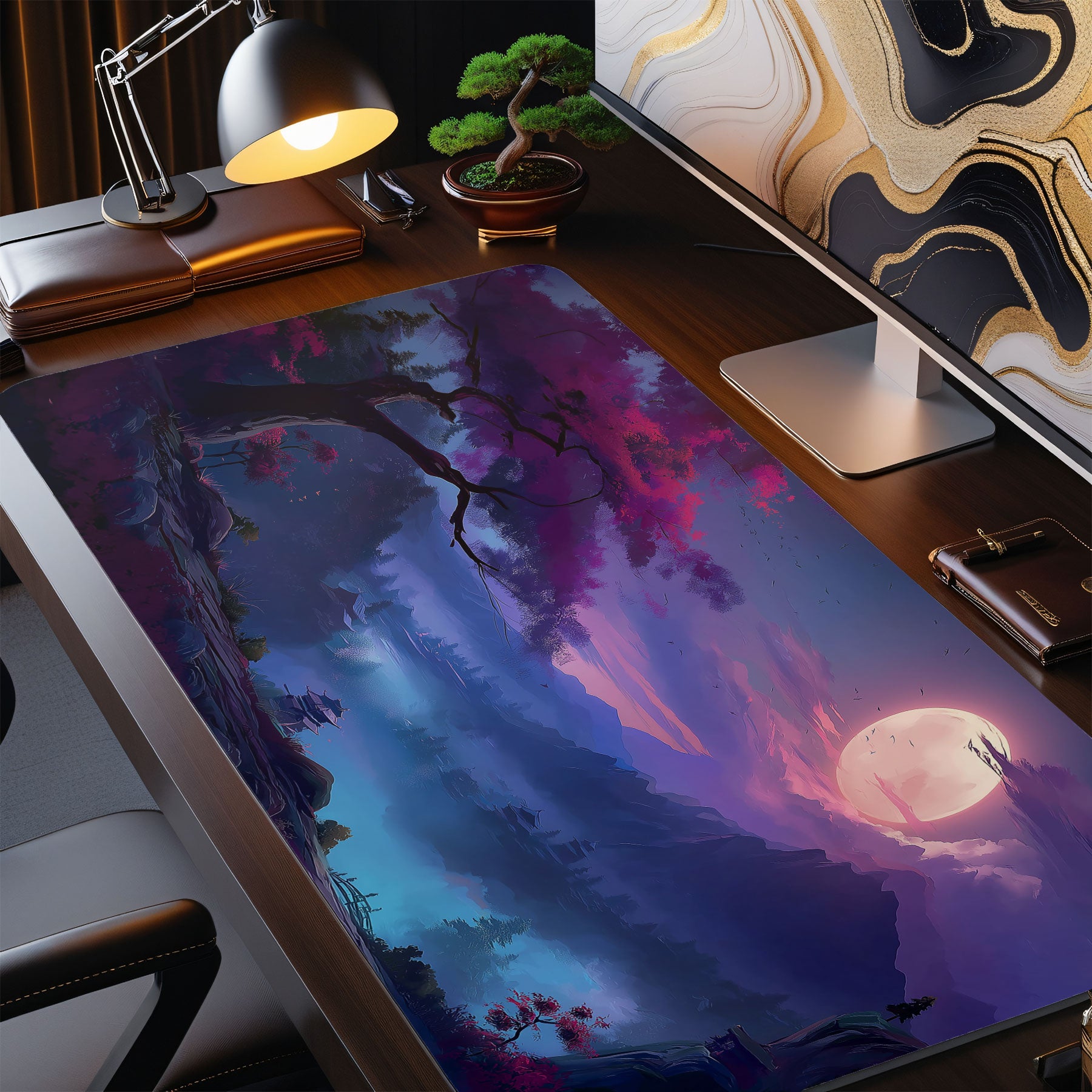 Desk setup with a large desk mat featuring a fantasy landscape design.