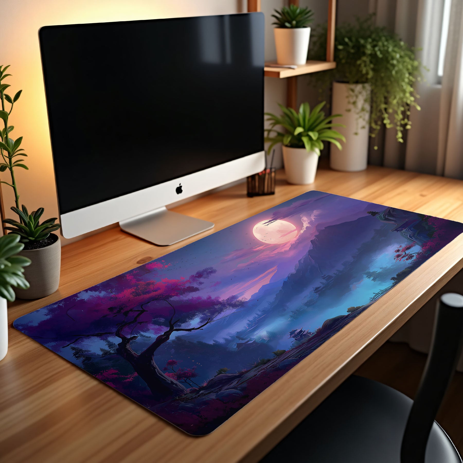Artistic desk mat with cherry blossom tree, glowing sky, and mountain scenery.