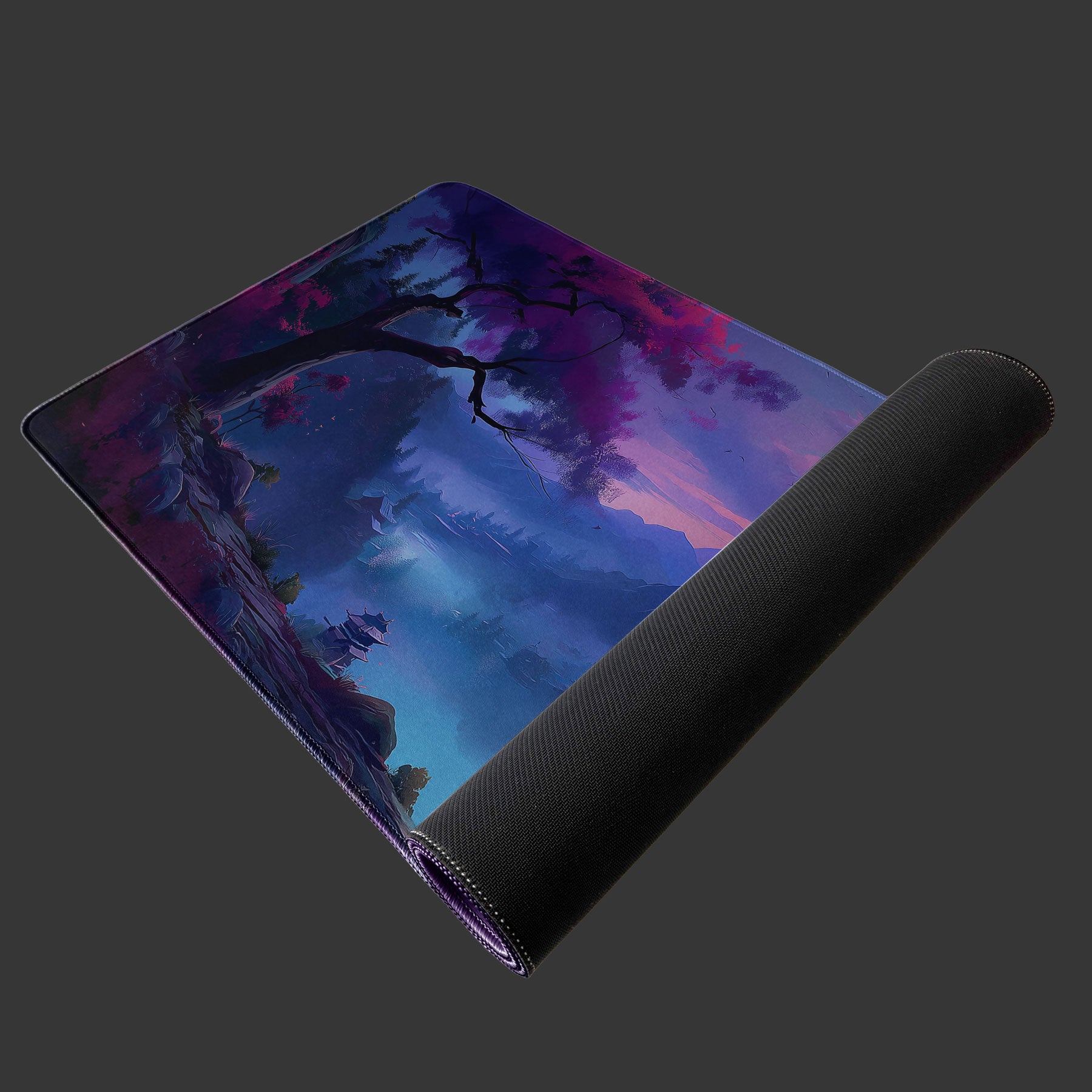 Large desk pad with Japanese night landscape, pink blossoms, and misty mountains.