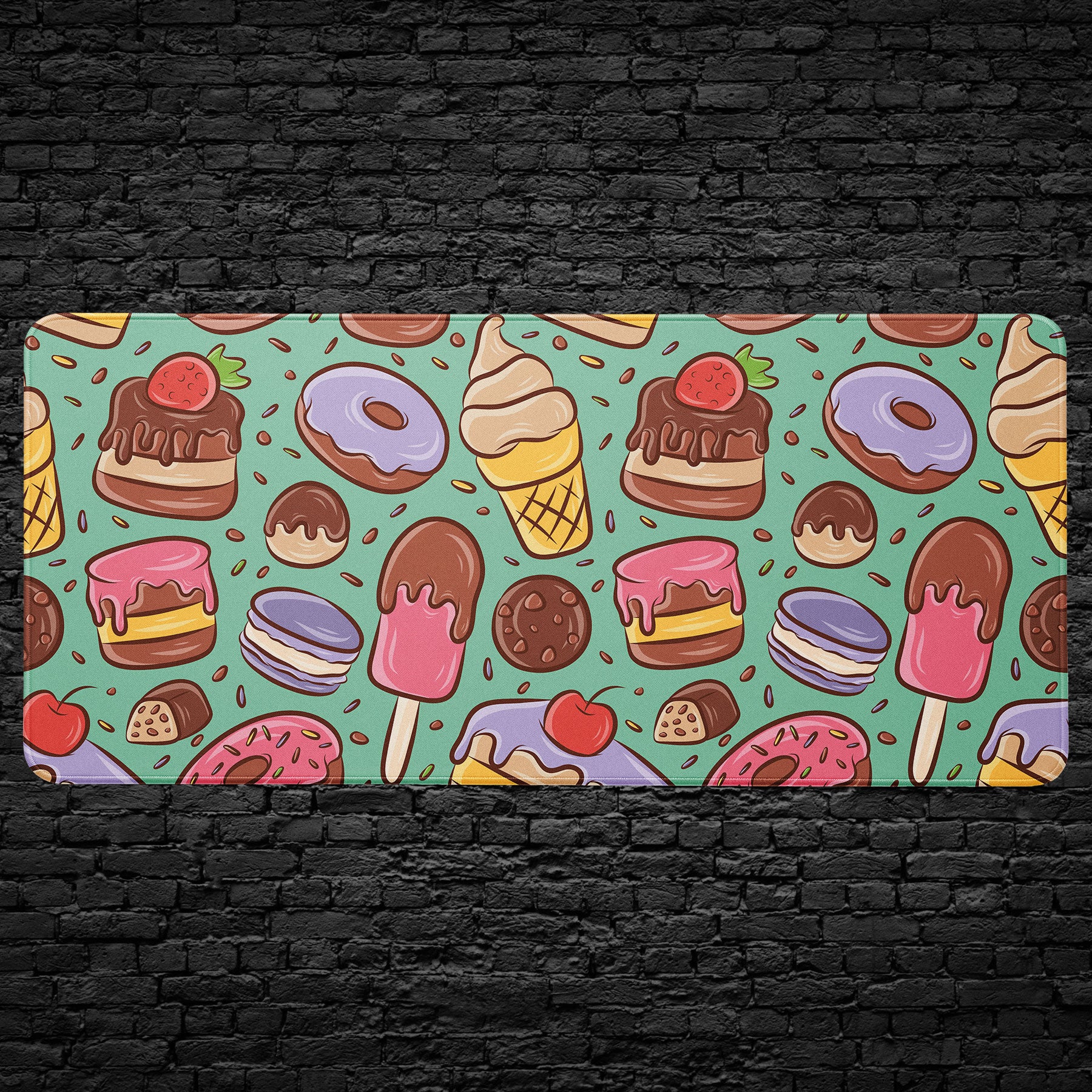 Desk mat with colorful dessert pattern including donuts and cakes