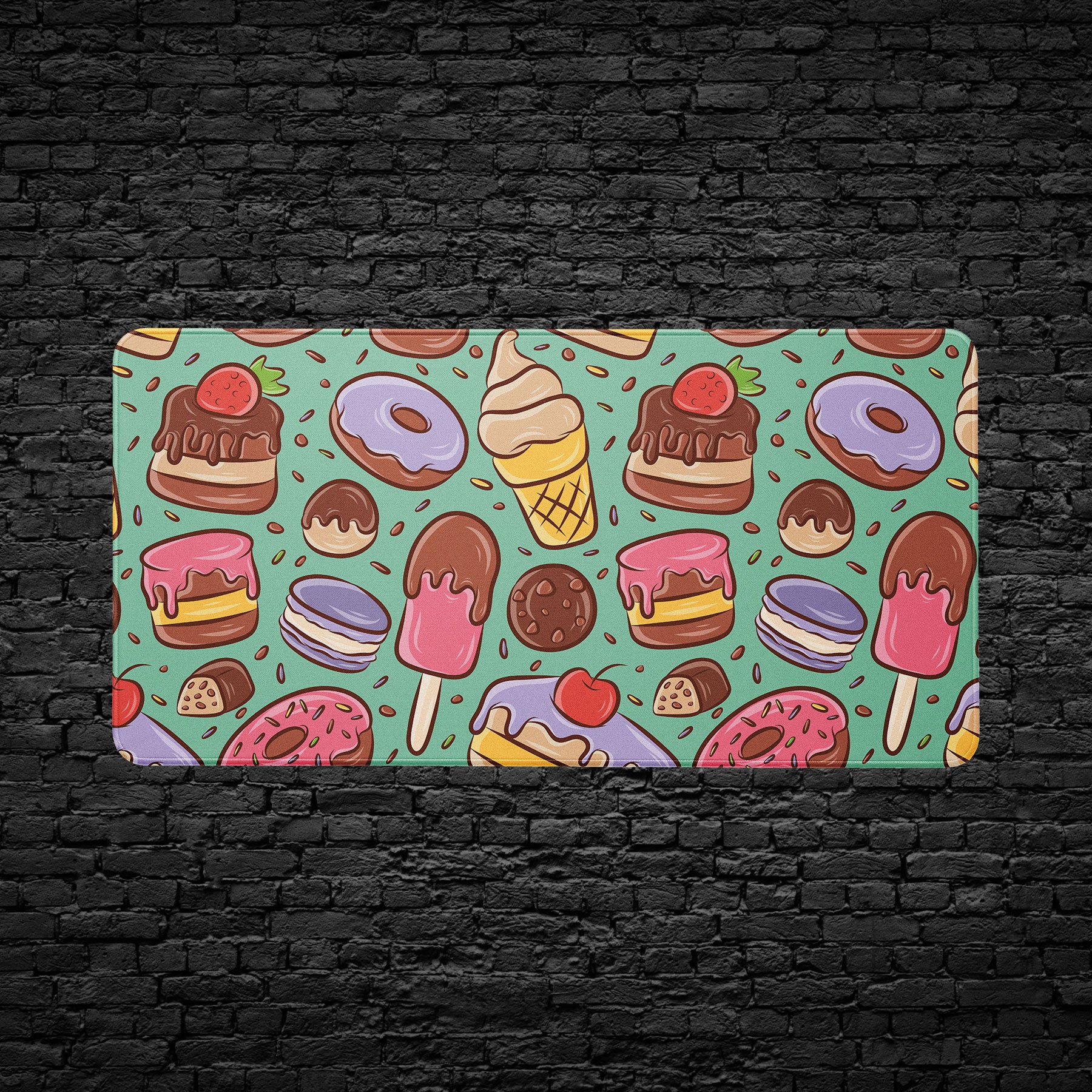 Playful dessert-themed desk mat with chocolate and macarons