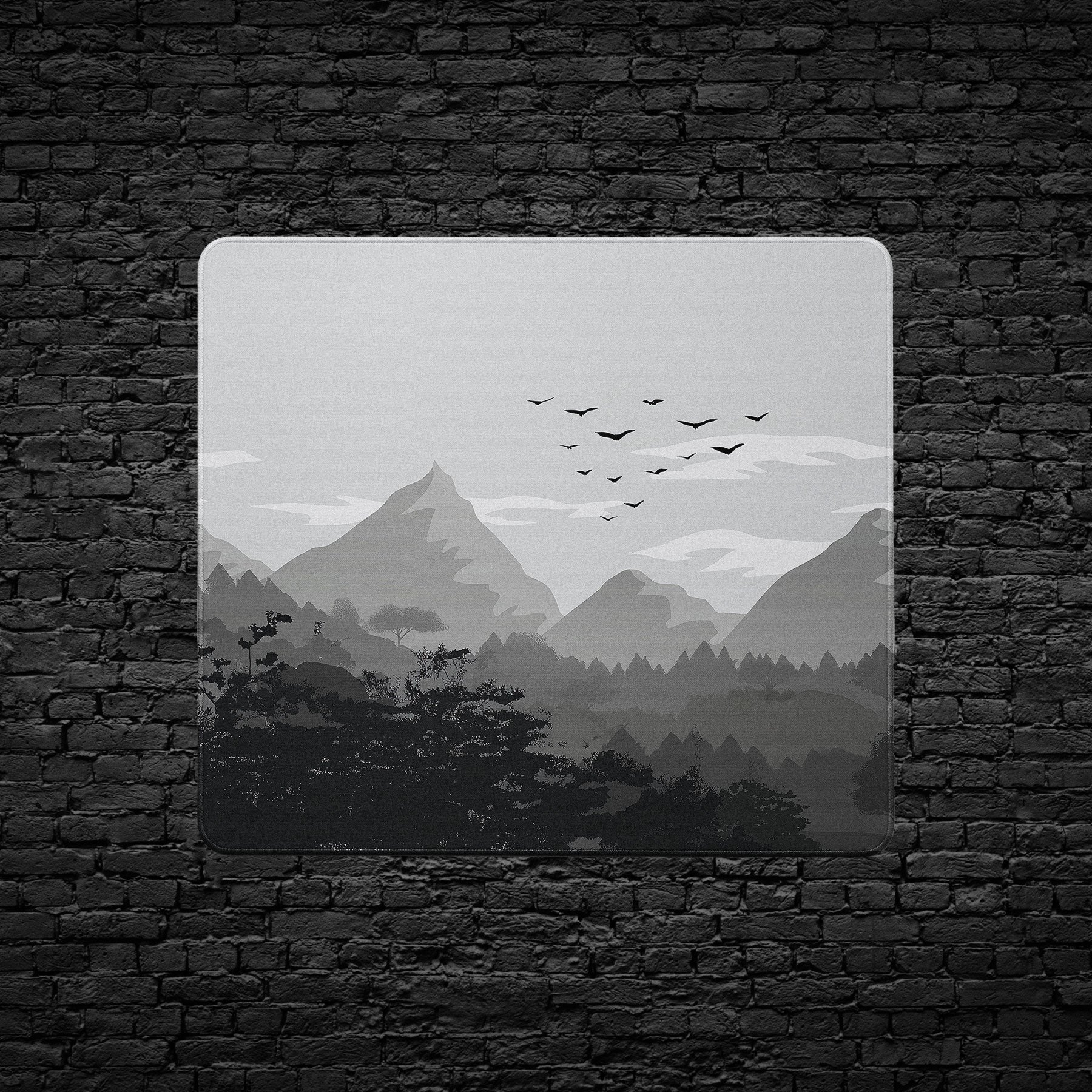 Custom desk mat with black-and-white mountain range artwork.